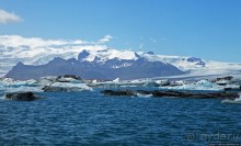 По лагуне причудливо-тающих льдов на плавающем авто-корабле