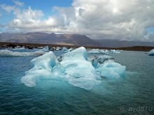 По лагуне причудливо-тающих льдов на плавающем авто-корабле