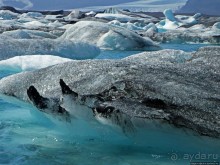 По лагуне причудливо-тающих льдов на плавающем авто-корабле