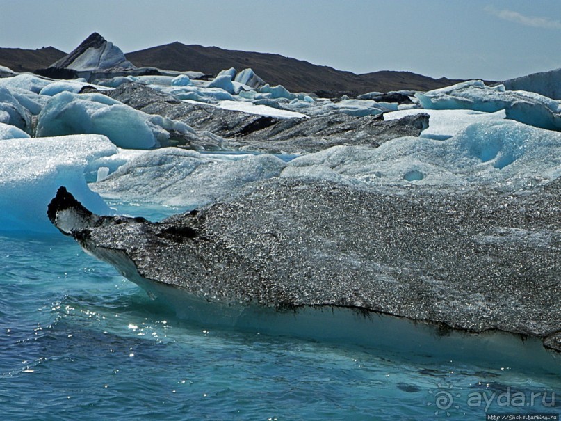 По лагуне причудливо-тающих льдов на плавающем авто-корабле