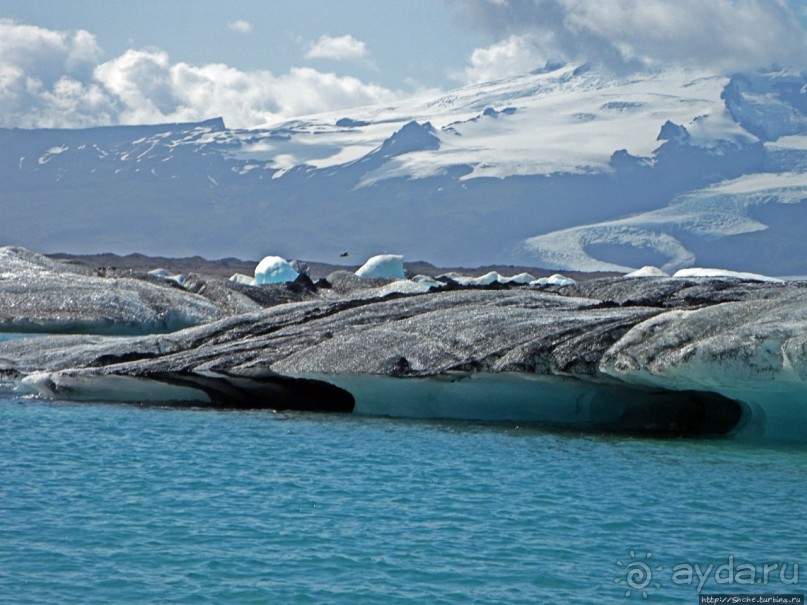 По лагуне причудливо-тающих льдов на плавающем авто-корабле