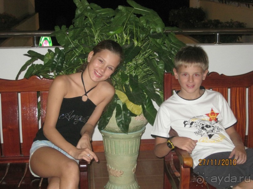 Рядом с номерами. 