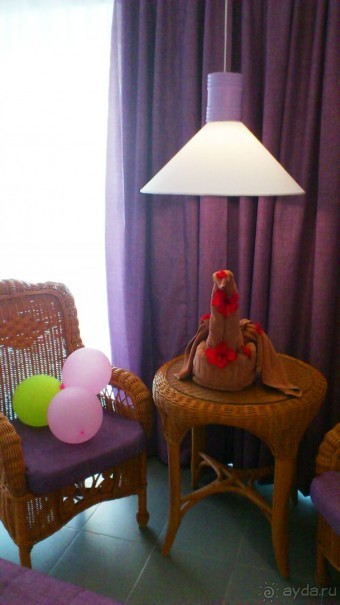 Птичка в цветах из полотенца 