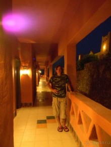 Наш сын в коридоре нашего корпуса перед дверью в номер.